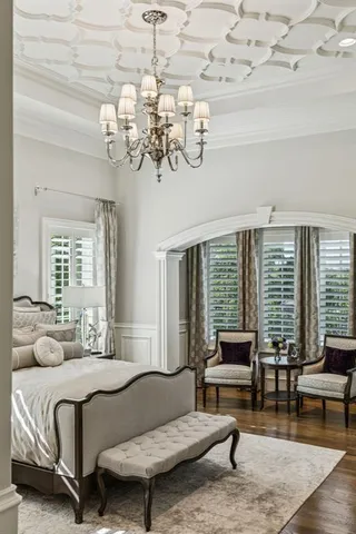 a large white kitchen with a large window