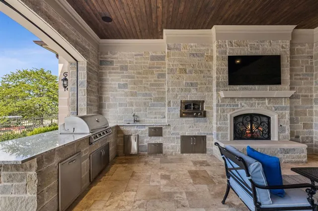 a view of an outdoor dining space with a table and chairs