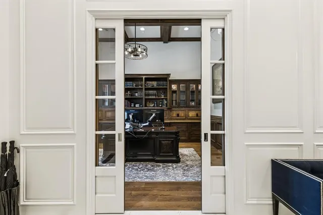 a living room with furniture or chandelier and a rug