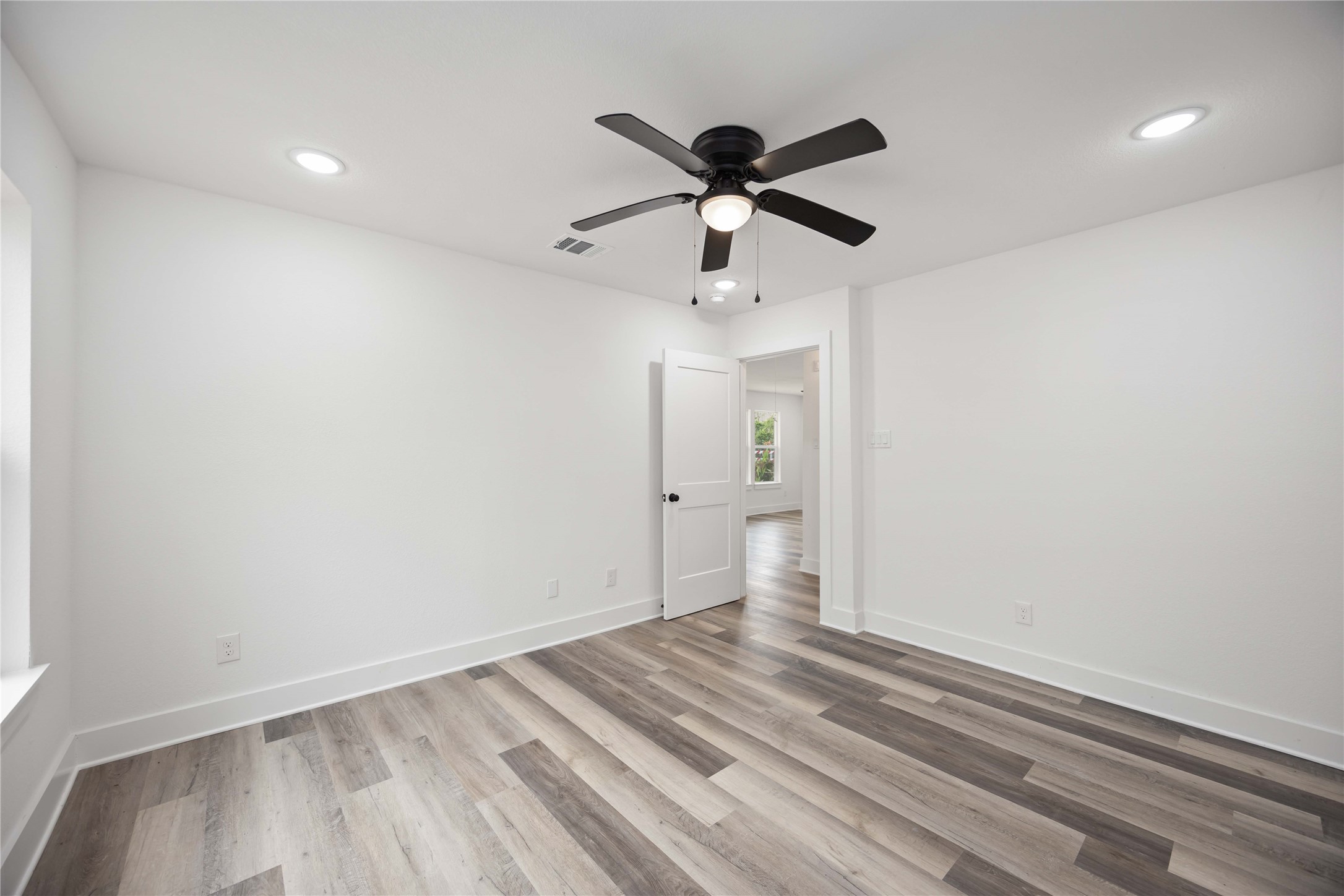 3405 Mt Pleasant Street Houston, TX 77021 - Photo 11 of 20 Primary suite featuring recess lighting and stylish and a ceiling fan, offering a comfortable and versatile space for any setup.