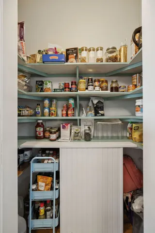 a bedroom with a bed and a table