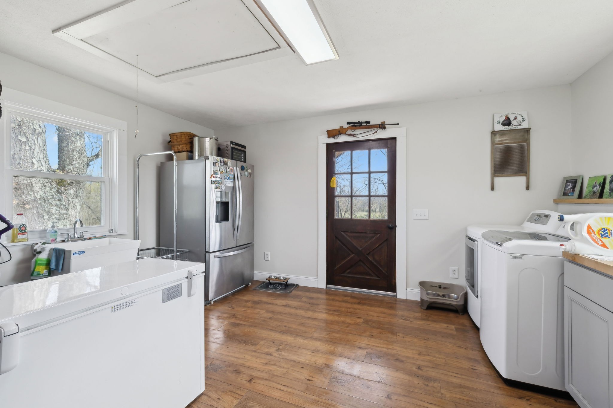 20 Bledsoe Borough Lane Riddleton, TN 37151 - Photo 28 of 72 a view of a kitchen with fridge and wooden floor