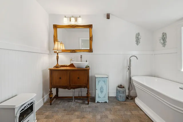 a view of room with window and wooden floor