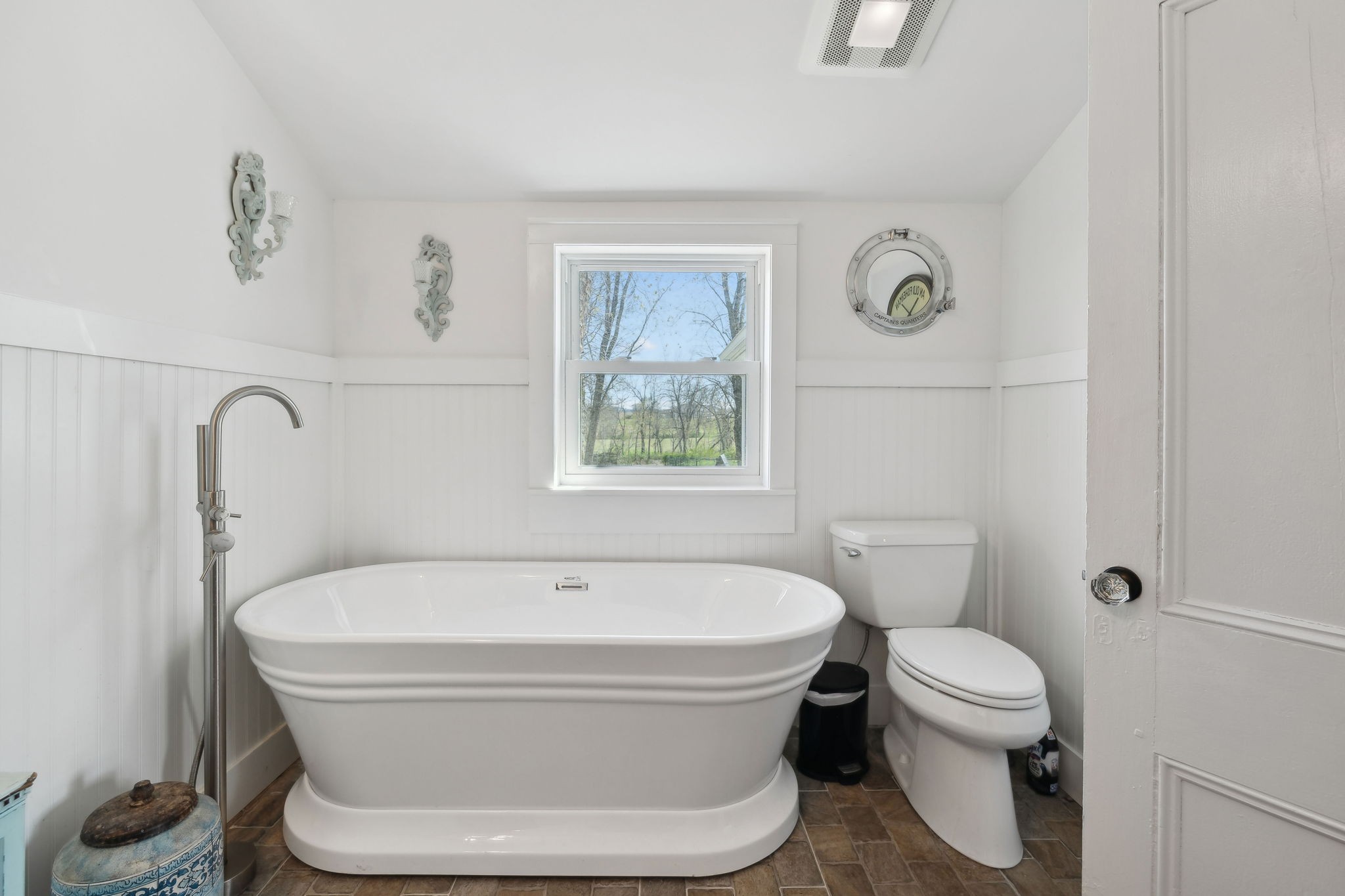20 Bledsoe Borough Lane Riddleton, TN 37151 - Photo 31 of 72 a white toilet sitting next to a bathroom sink and tub