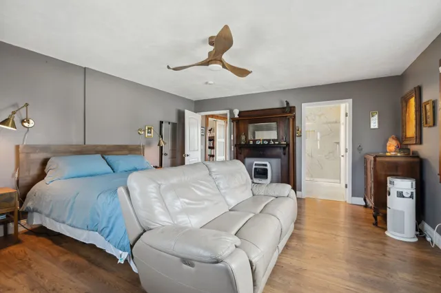 a yellow building in the middle of a yard