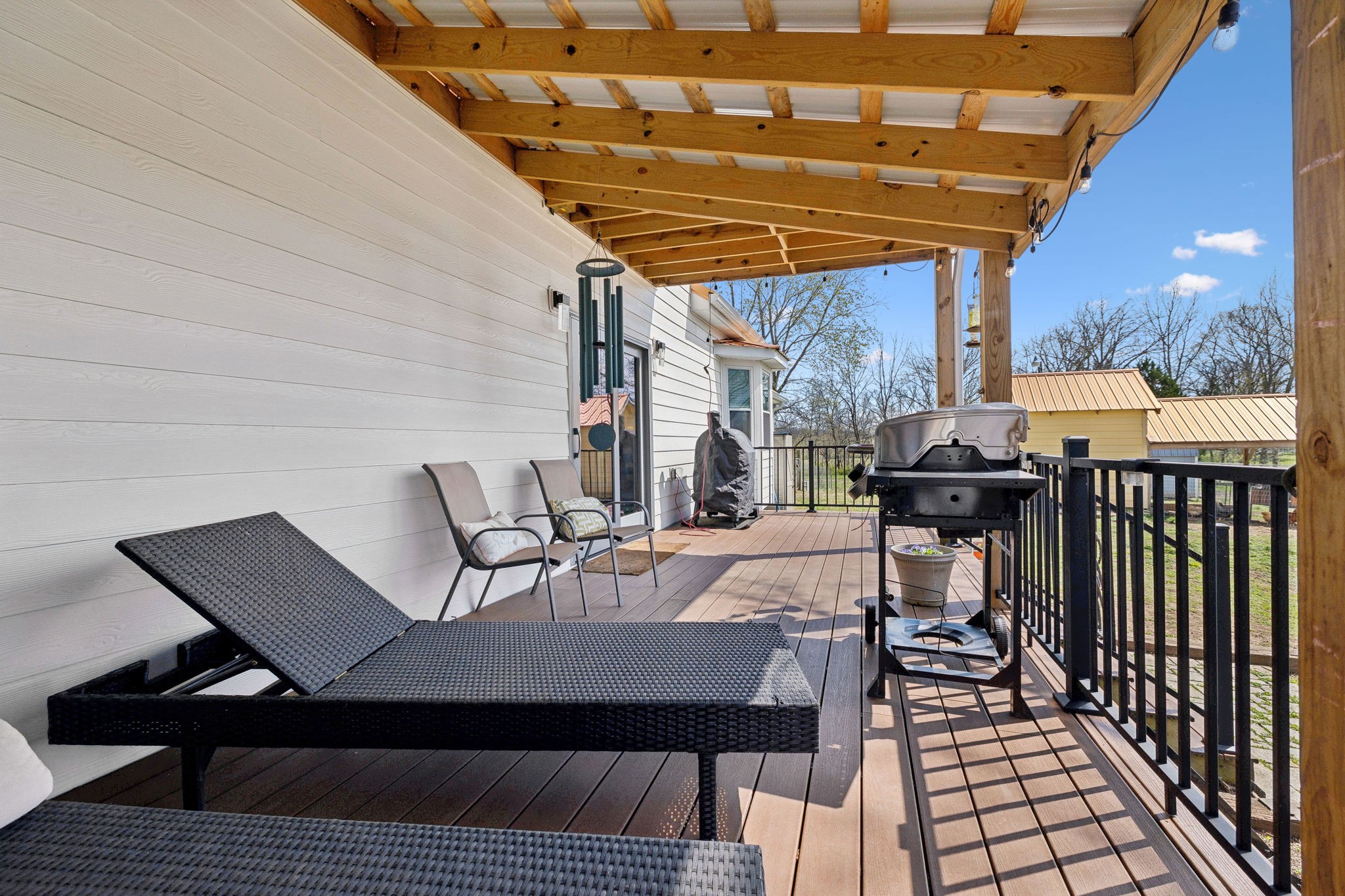 20 Bledsoe Borough Lane Riddleton, TN 37151 - Photo 51 of 72 a view of a roof deck with table and chairs with wooden floor and fence