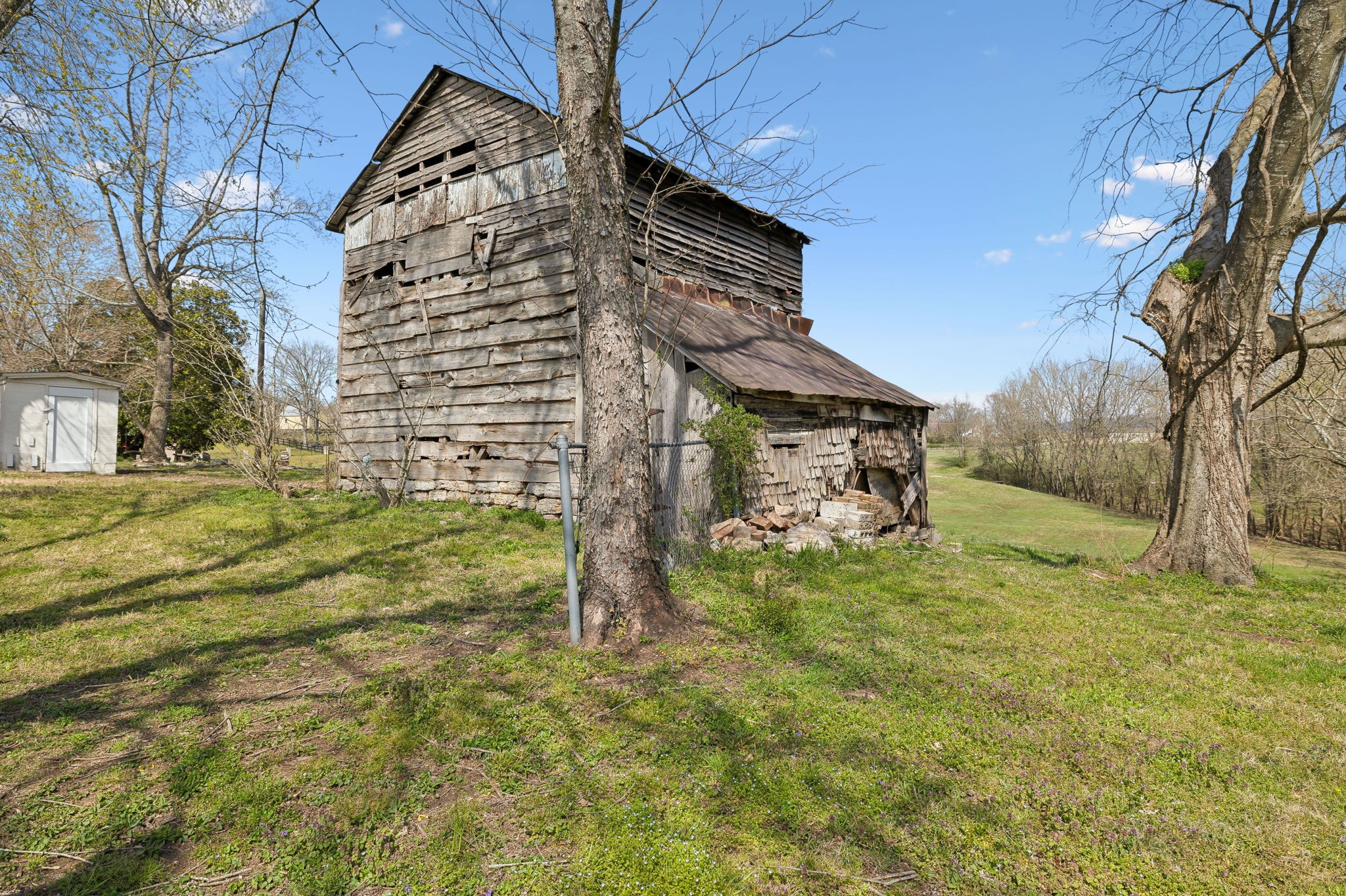 20 Bledsoe Borough Lane Riddleton, TN 37151 - Photo 59 of 72 a yellow building in the middle of a yard