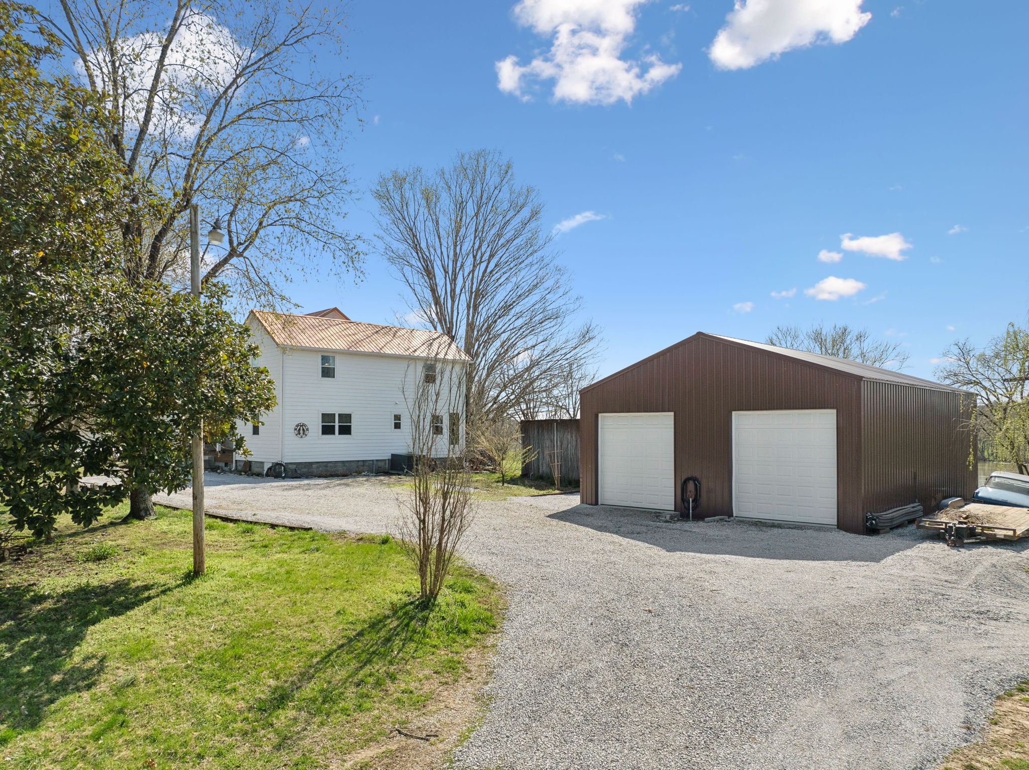 20 Bledsoe Borough Lane Riddleton, TN 37151 - Photo 60 of 72 a front view of a house with a yard and garage