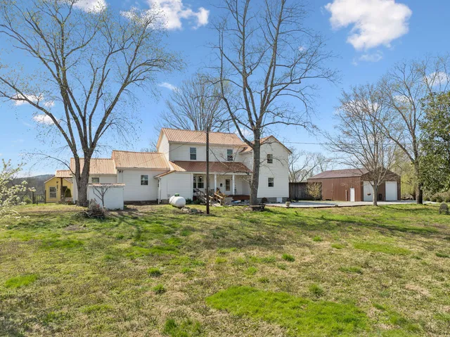 a living room with furniture fireplace and a flat screen tv