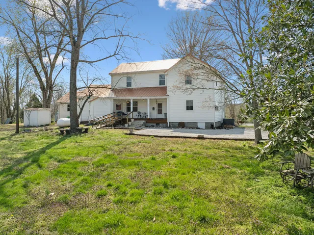 a living room with fireplace furniture and a flat screen tv