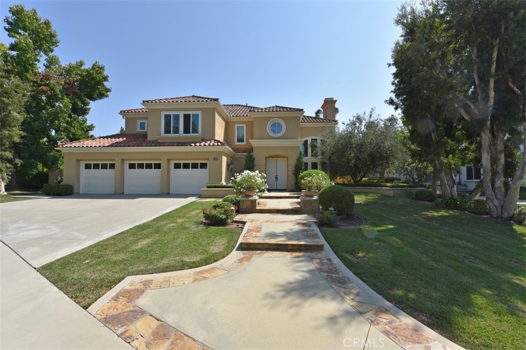 12 Brigadier Irvine, CA 92603 - Photo 1 of 50 a front view of a house with a yard table and chairs