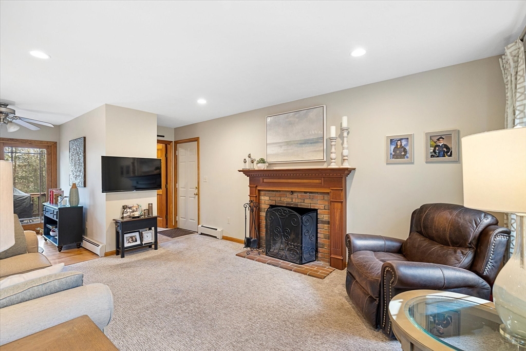 33 Glendale Road Sturbridge, MA 01518 - Photo 13 of 27 a living room with furniture and a fireplace