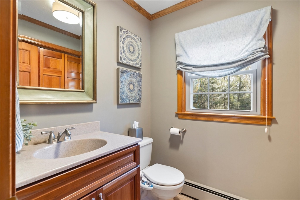 33 Glendale Road Sturbridge, MA 01518 - Photo 14 of 27 a bathroom with a sink a toilet and a window