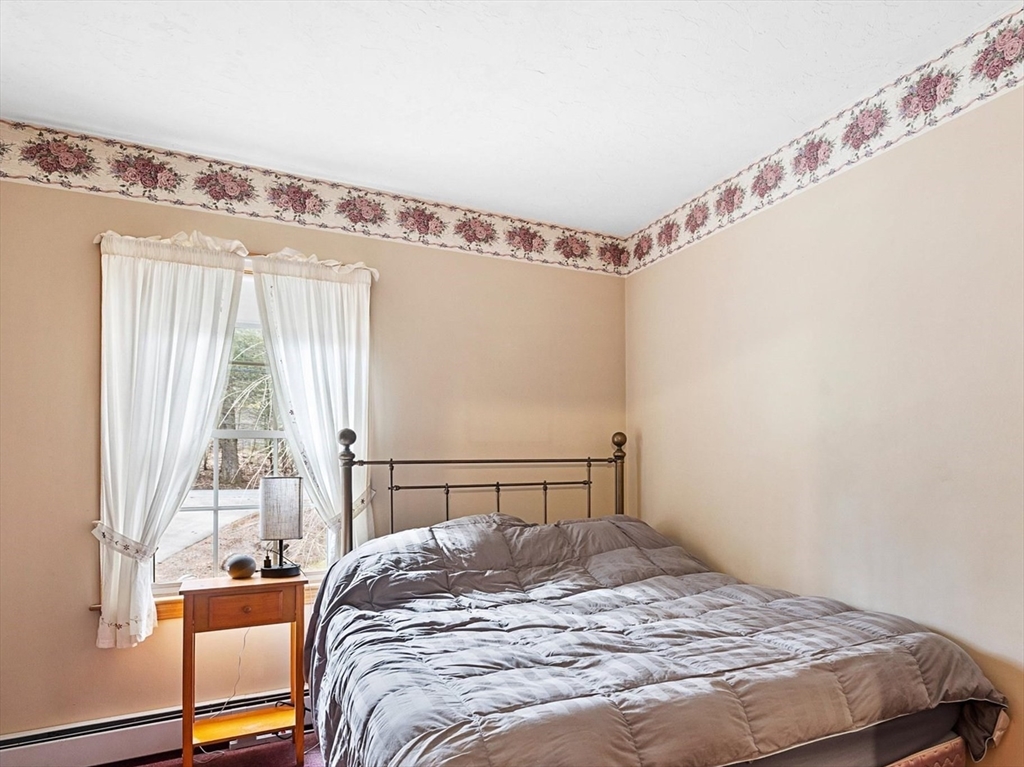 33 Glendale Road Sturbridge, MA 01518 - Photo 20 of 27 a bedroom with a bed and a window