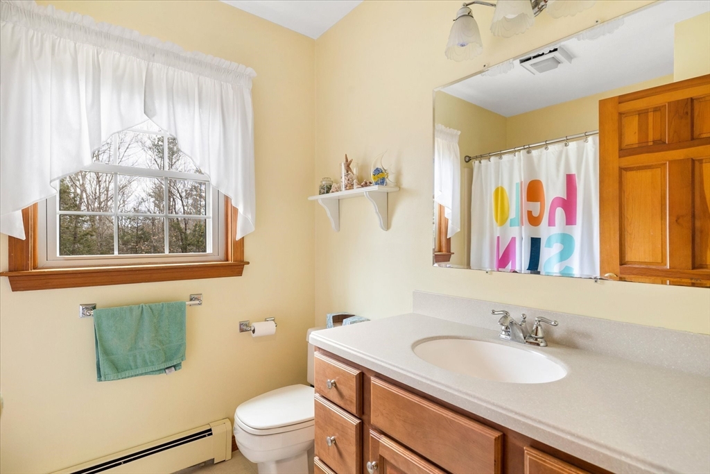 33 Glendale Road Sturbridge, MA 01518 - Photo 21 of 27 a bathroom with a granite countertop sink mirror and a toilet