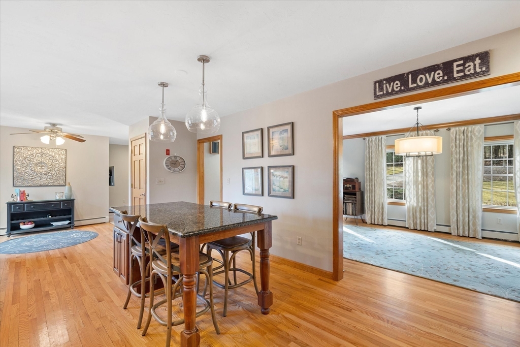 33 Glendale Road Sturbridge, MA 01518 - Photo 9 of 27 a view of a dining room with furniture and wooden floor