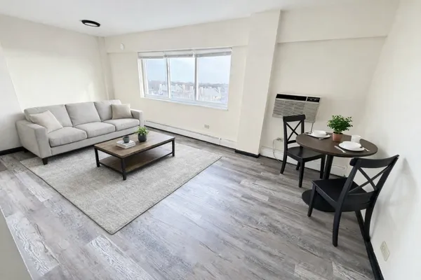 a living room with furniture and a window