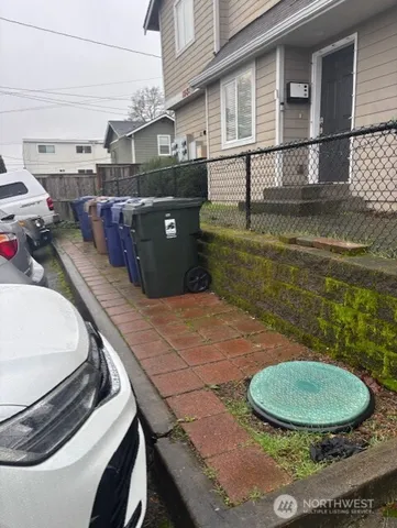 a view of a backyard with seating area