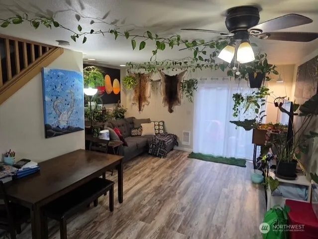a living room with lots of furniture and a chandelier
