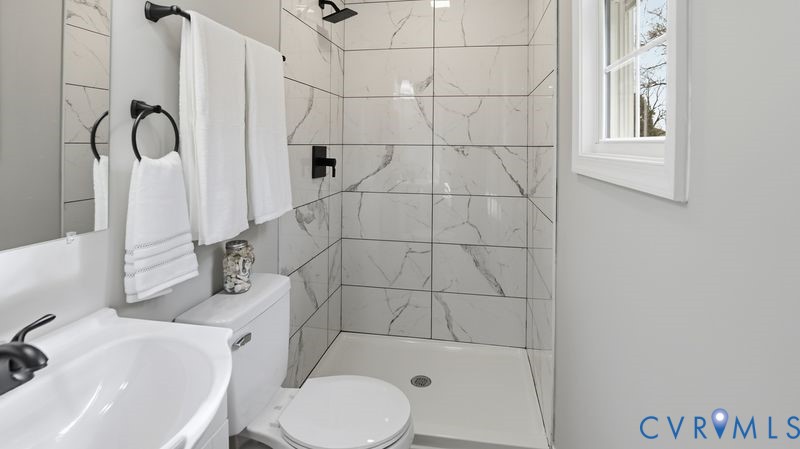 25209 Ritchie Avenue Petersburg, VA 23803 - Photo 26 of 50 a bathroom with a sink toilet and shower