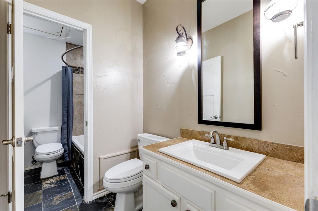 5310 Keller Springs Road, Unit 413 Dallas, TX 75248 - Photo 14 of 20 a bathroom with a granite countertop sink toilet and shower