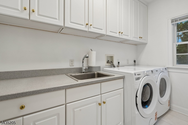 12 Oak Hill Road Bernards, NJ 07920 - Photo 17 of 33 a view with cabinets and washer