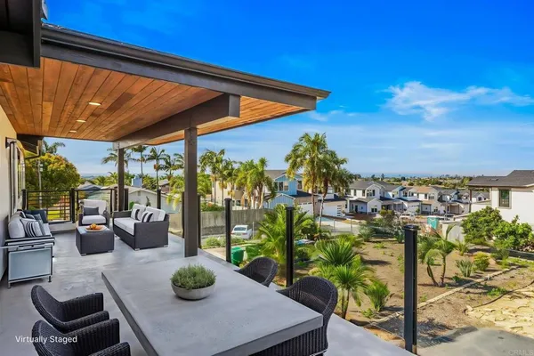 a view of a chairs and table in patio