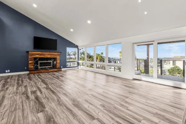 a view of a livingroom with furniture wooden floor and window