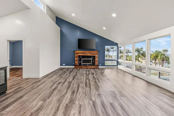 a room with wooden floor and furniture