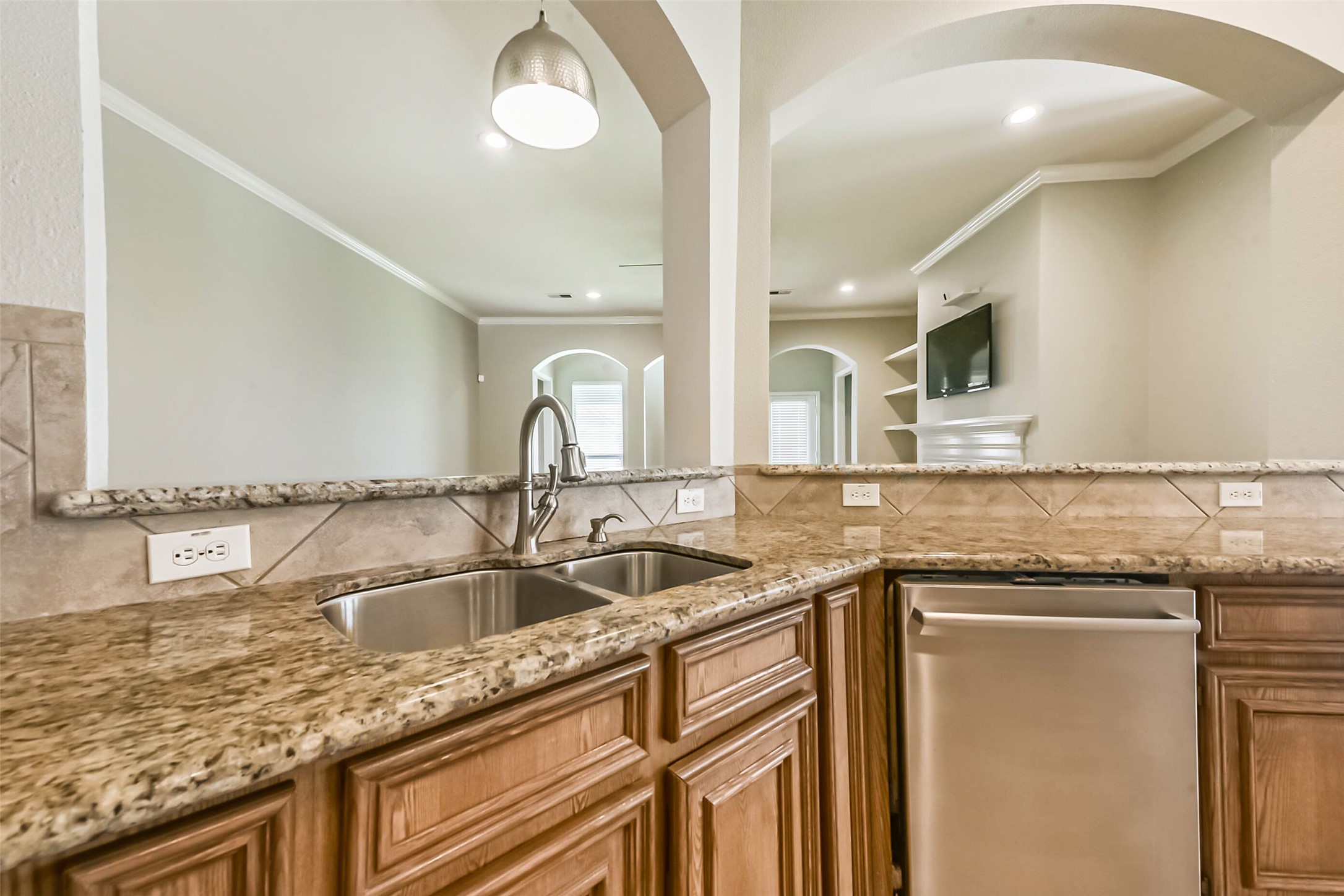 15910 Chart House Court Houston, TX 77044 - Photo 11 of 45 a kitchen with granite countertop a sink and cabinets