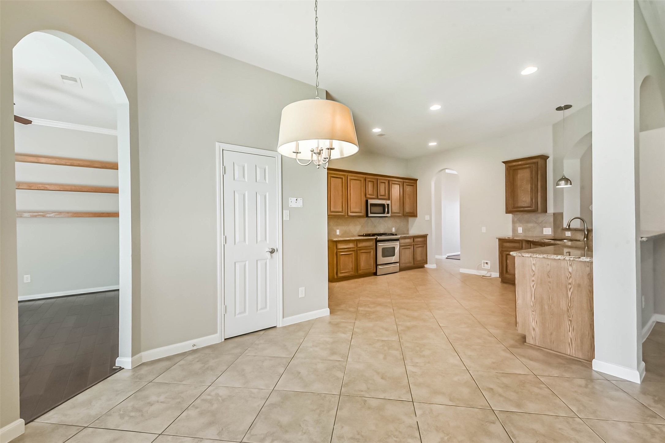 15910 Chart House Court Houston, TX 77044 - Photo 14 of 45 a view of kitchen with granite countertop cabinets and refrigerator