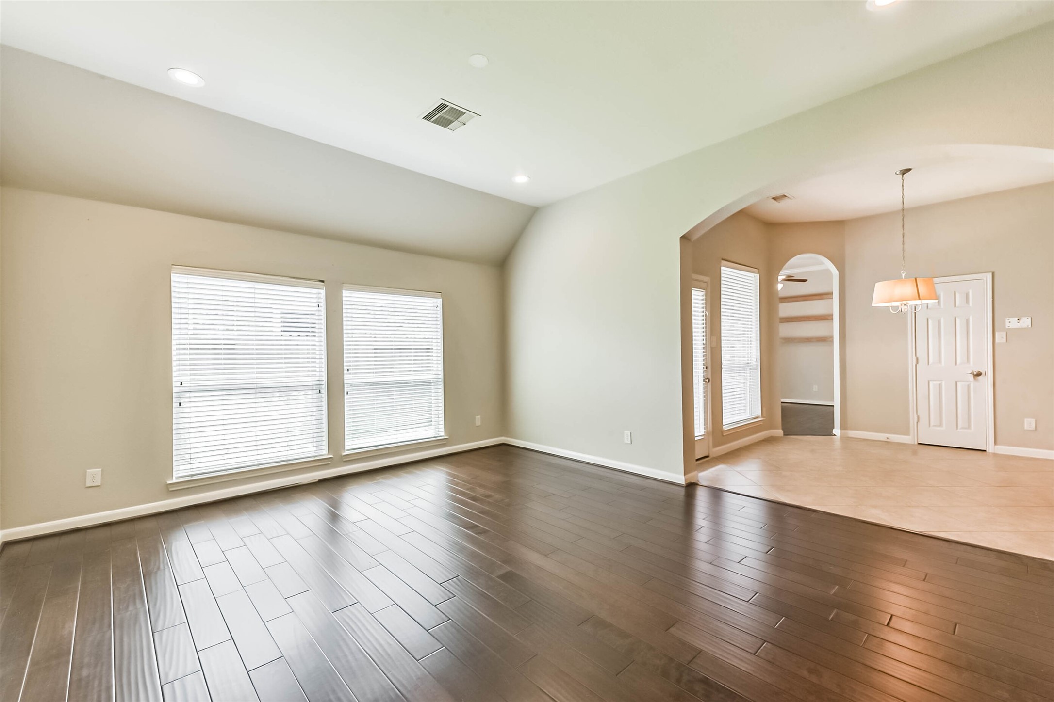 15910 Chart House Court Houston, TX 77044 - Photo 16 of 45 an empty room with wooden floor and windows