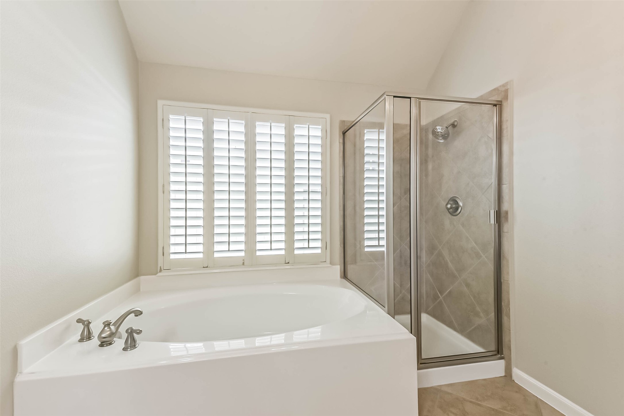 15910 Chart House Court Houston, TX 77044 - Photo 26 of 45 a bathroom with a bathtub and shower