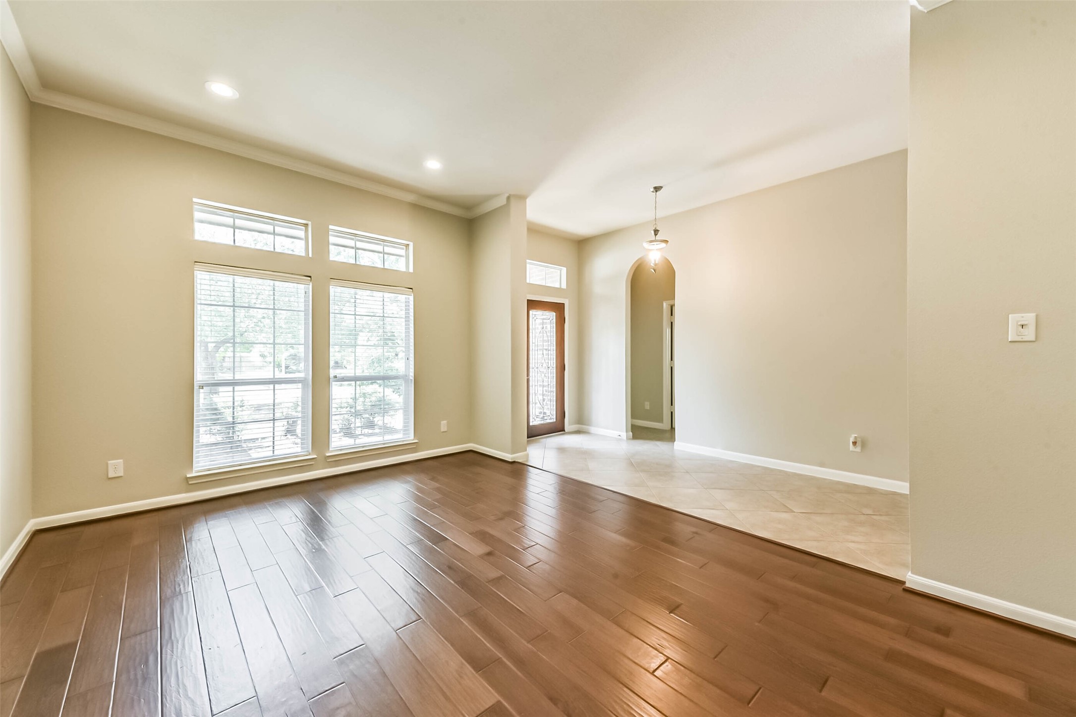 15910 Chart House Court Houston, TX 77044 - Photo 33 of 45 an empty room with wooden floor and windows