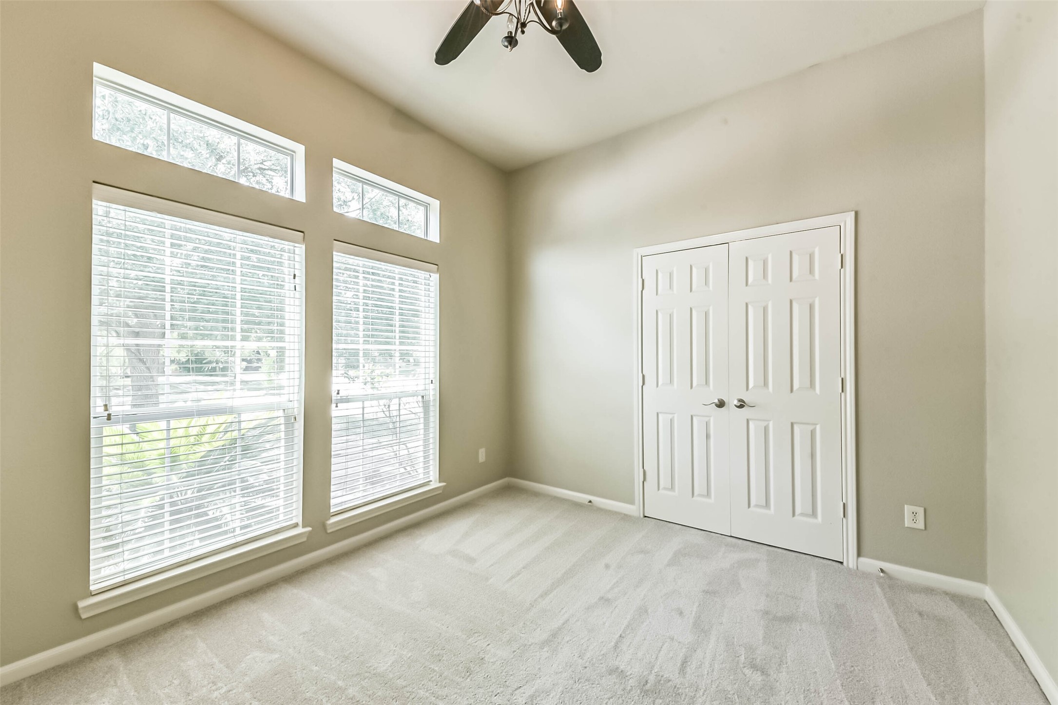 15910 Chart House Court Houston, TX 77044 - Photo 35 of 45 a view of an empty room with window and a ceiling fan