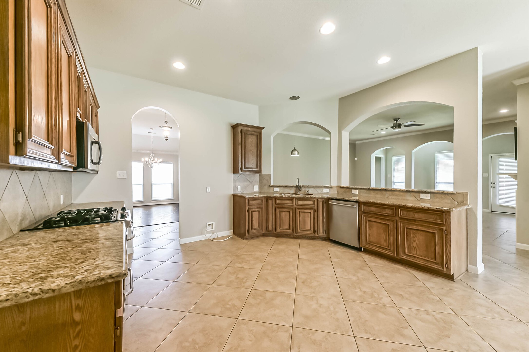 15910 Chart House Court Houston, TX 77044 - Photo 8 of 45 a large bathroom with a granite countertop double vanity sink a mirror and a bathtub