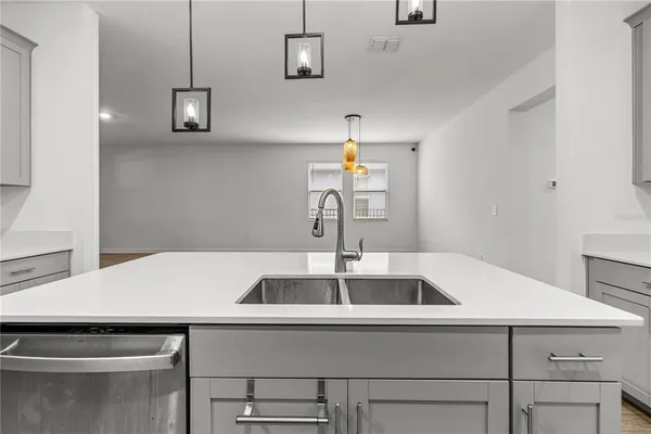 a kitchen with a sink and cabinets
