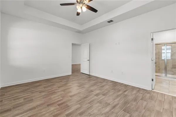 a view of an empty room with glass door