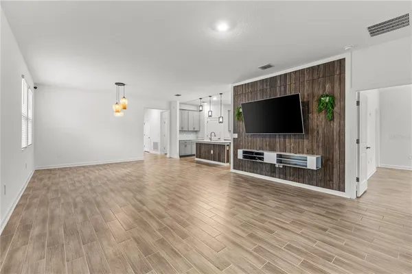a view of a livingroom with furniture and a flat screen tv