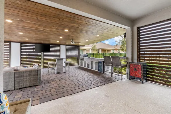 a view of a patio with table and chairs