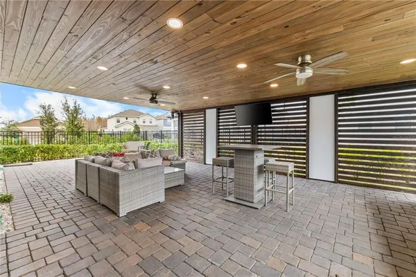 a sitting area with furniture and a garden