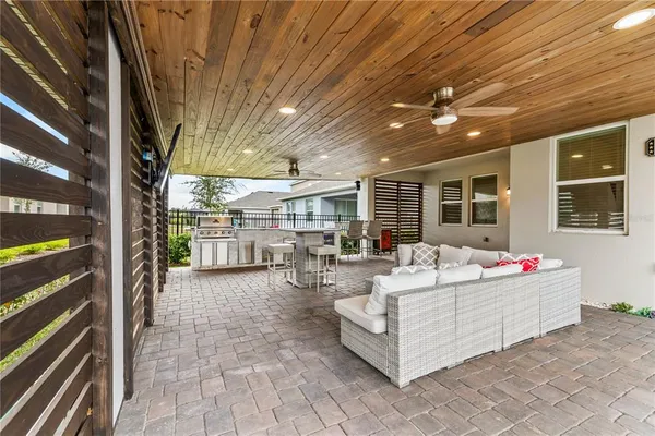 a view of a patio with table and chairs