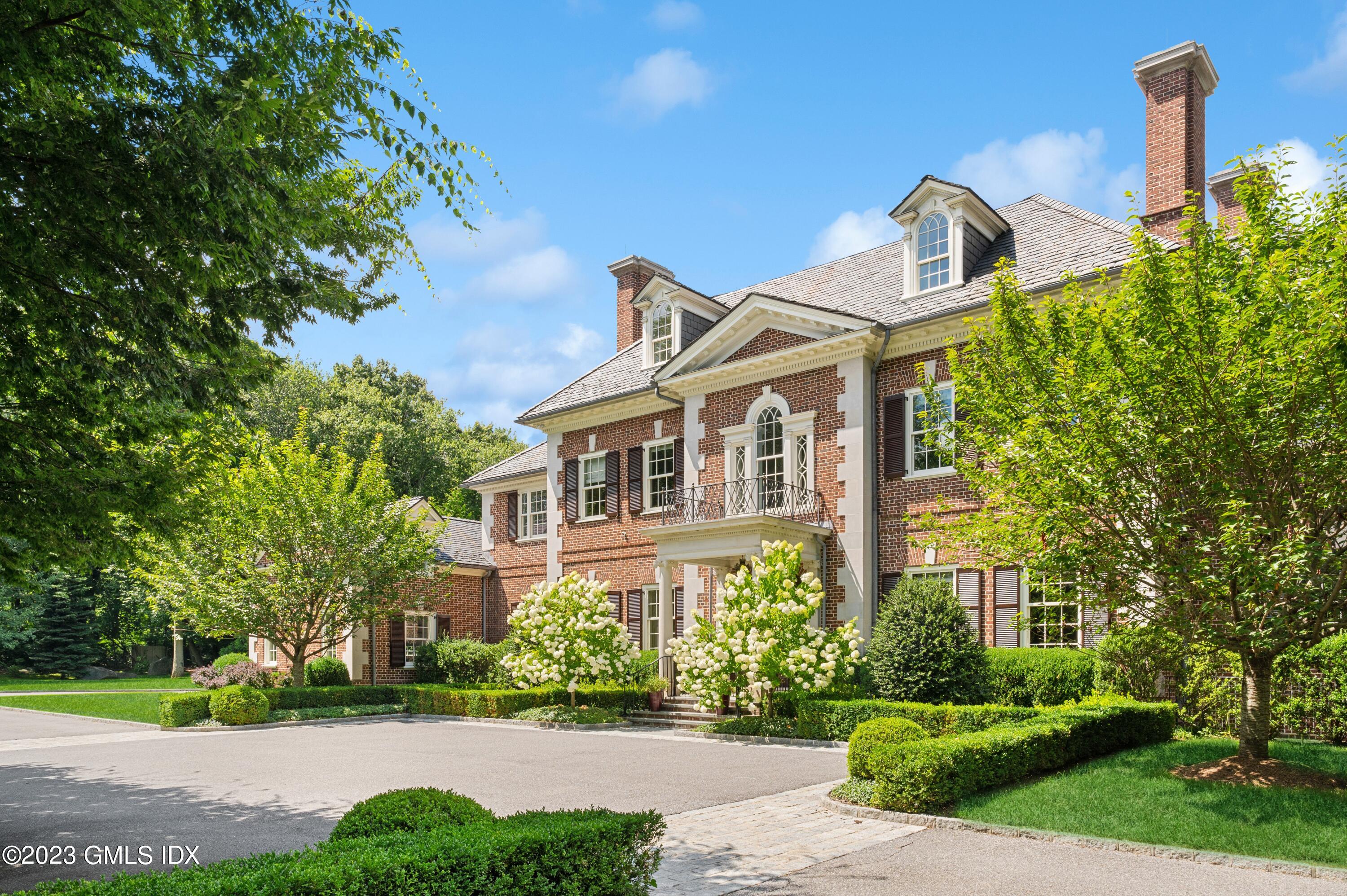 3 Hekma Road Greenwich, CT 06831 - Photo 3 of 6 a front view of a house with a yard
