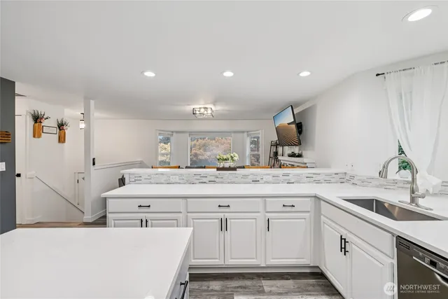 a spacious bathroom with a double vanity sink a mirror and a shower