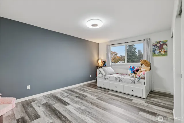 a room with a bed and window