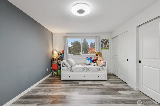 a bed room with a bed and a window