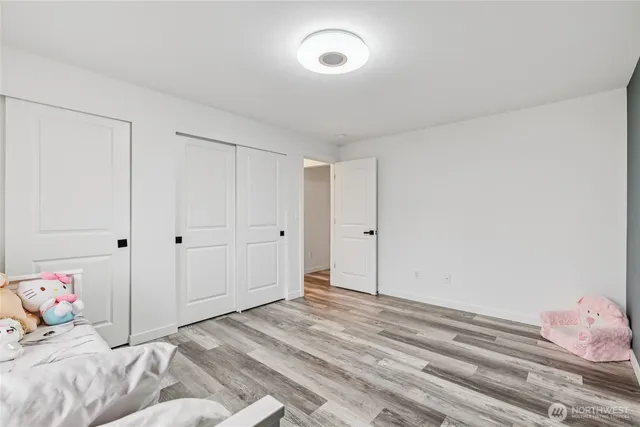 a bedroom with a bed and hallway