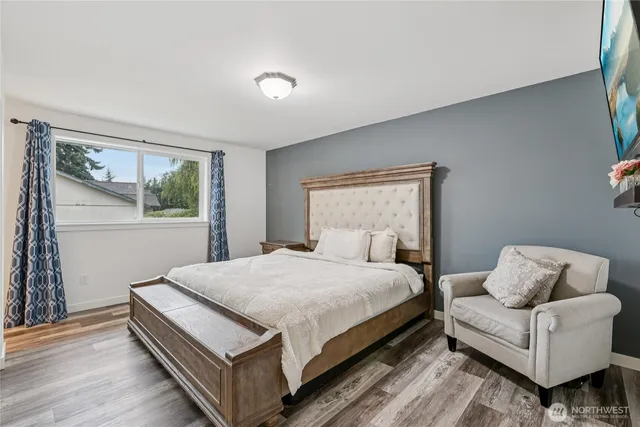 a bedroom with a bed and a couch