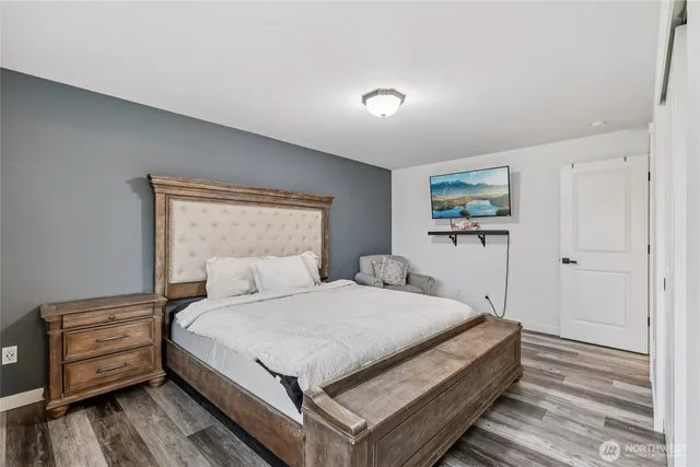 a bedroom with a bed and a dresser