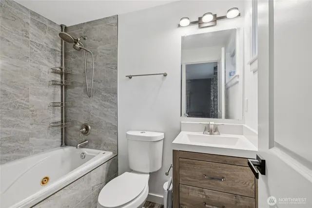 a bathroom with a sink toilet a bathtub and shower